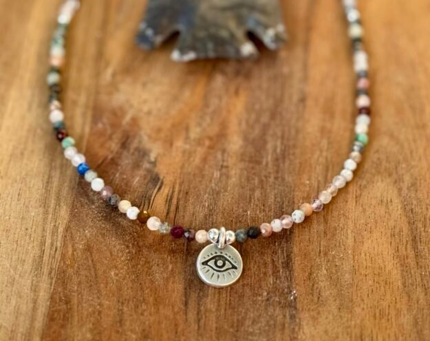 crystal/gemstone faceted necklace with evil eye charm