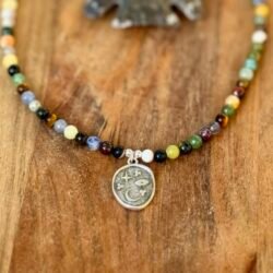 crystal/gemstone necklace with celestial moon & stars charm