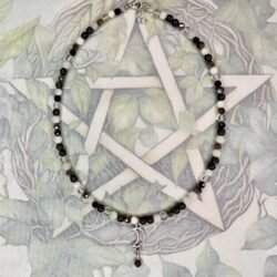 4mm Choker length beaded necklace with Crescent moon charm and pyrite, black tourmaline, onyx, moonstone, clear quartz and white jade